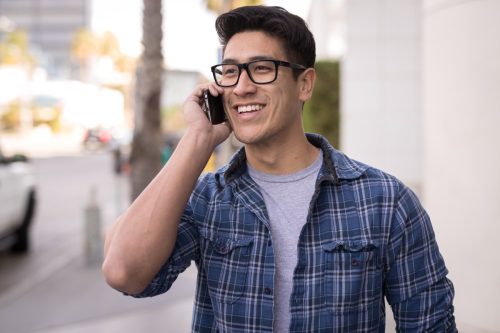 Man taking a phone call while walking