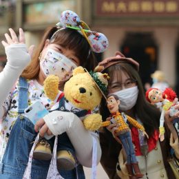 two young girls pose for a photo at shanghai disneyland