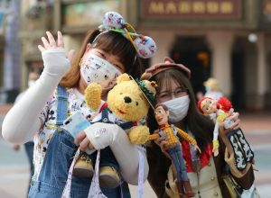 two young girls pose for a photo at shanghai disneyland