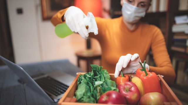 Woman disinfecting produce