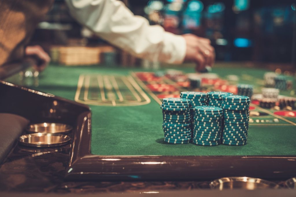 a stack of chips on a casino table