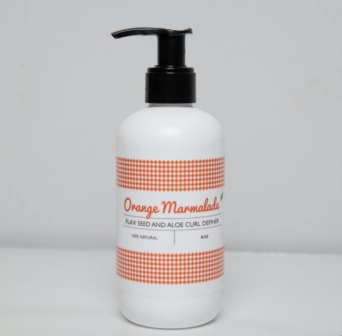 bottle of orange marmalade hair care