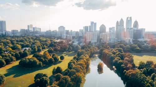 Aerial over Piedmont Park with Atlanta, GA Skyline
