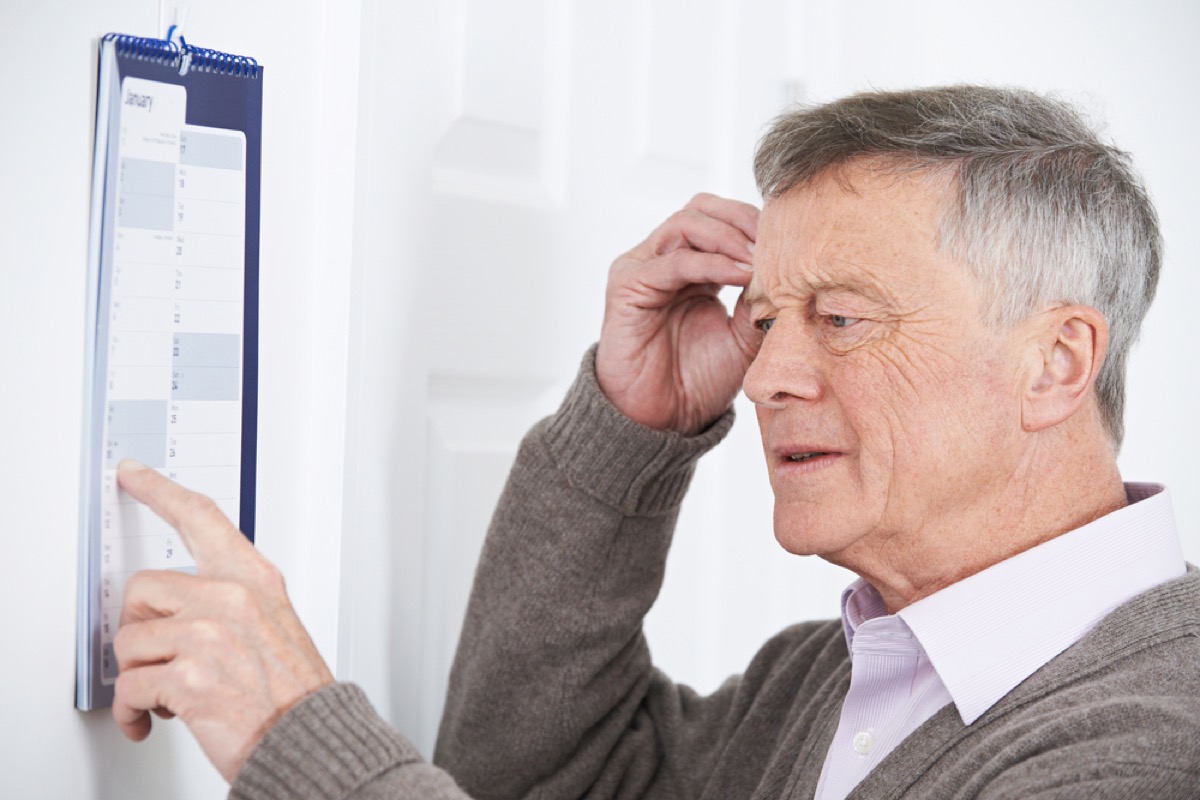 confused older white man pointing at calendar
