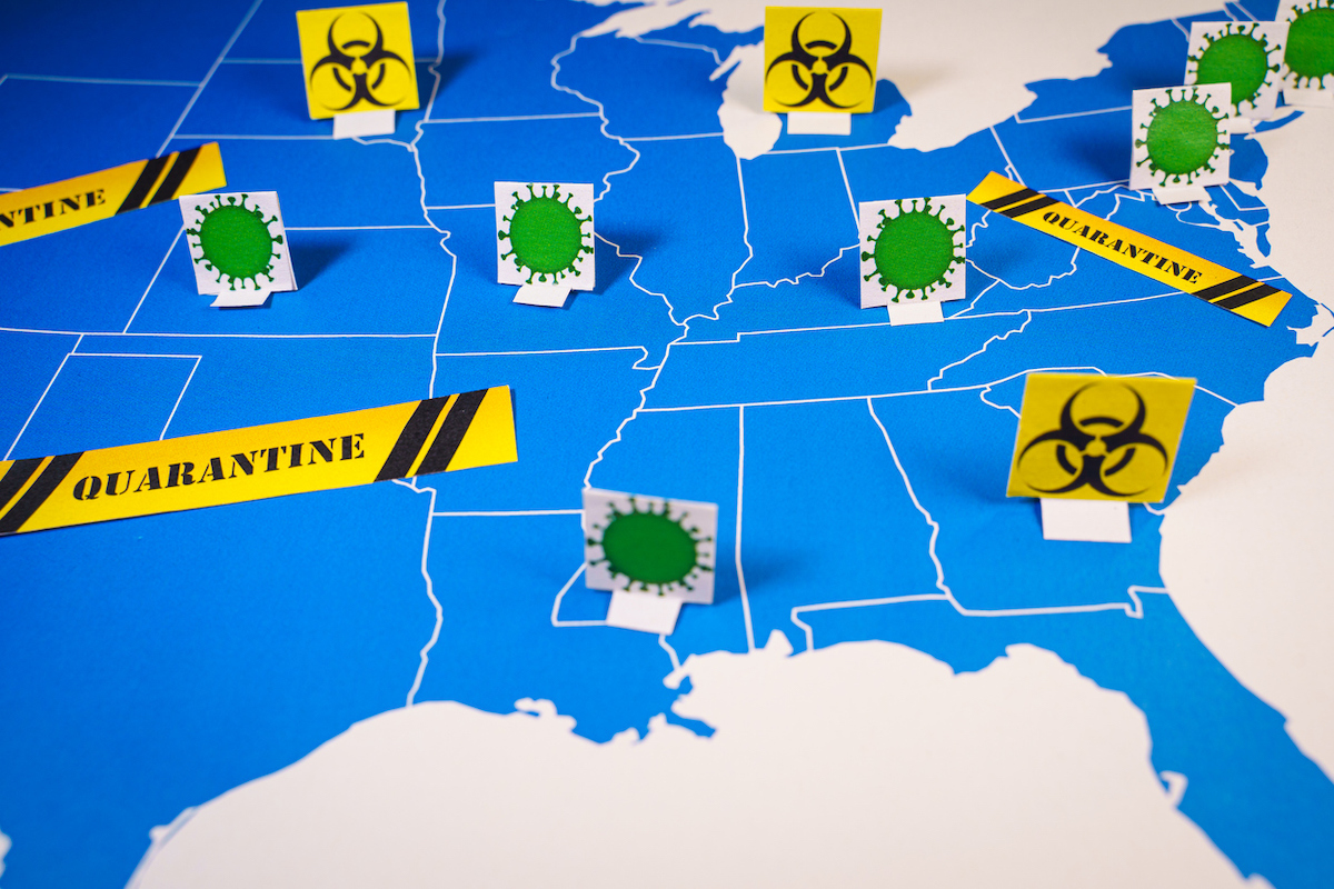 Map of united states with coronavirus and quarantine signs