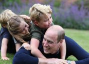 prince william plays in grass with prince george, princess charlotte, and prince louis