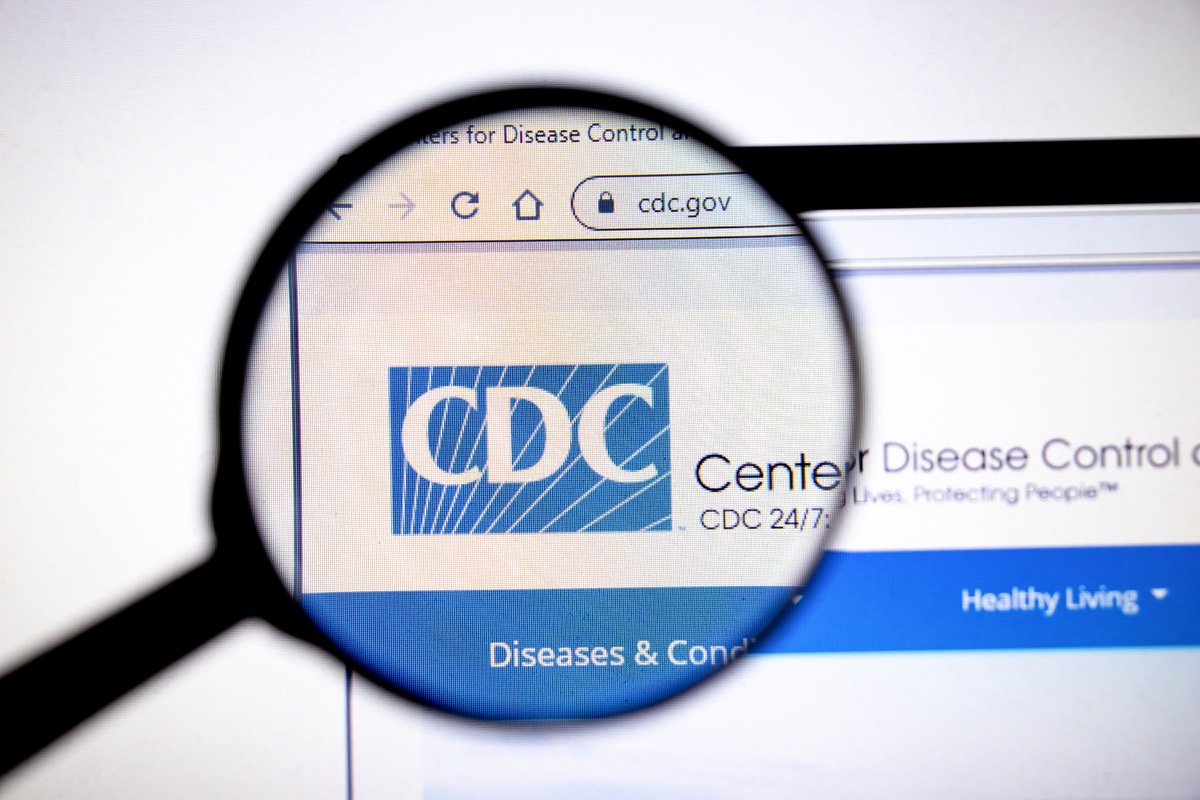 Magnifying glass viewing CDC webpage