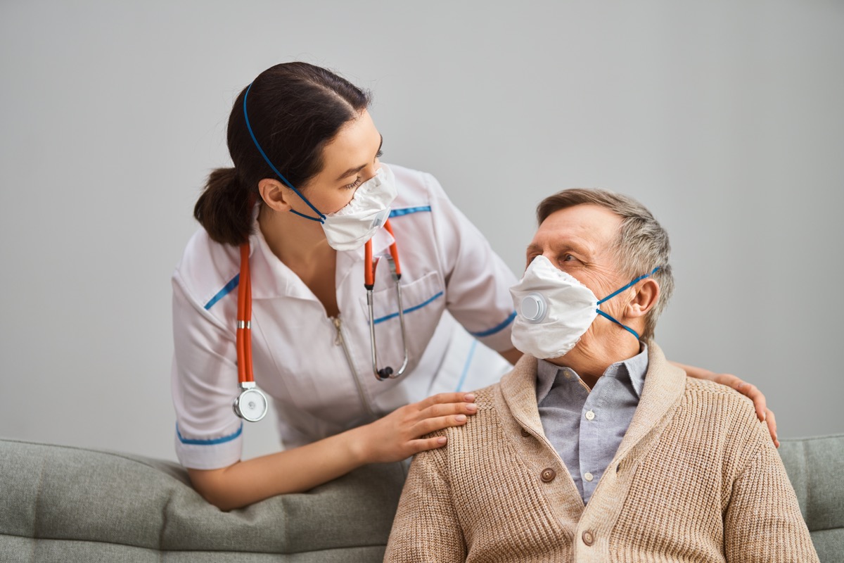 Elderly patient and doctor with masks