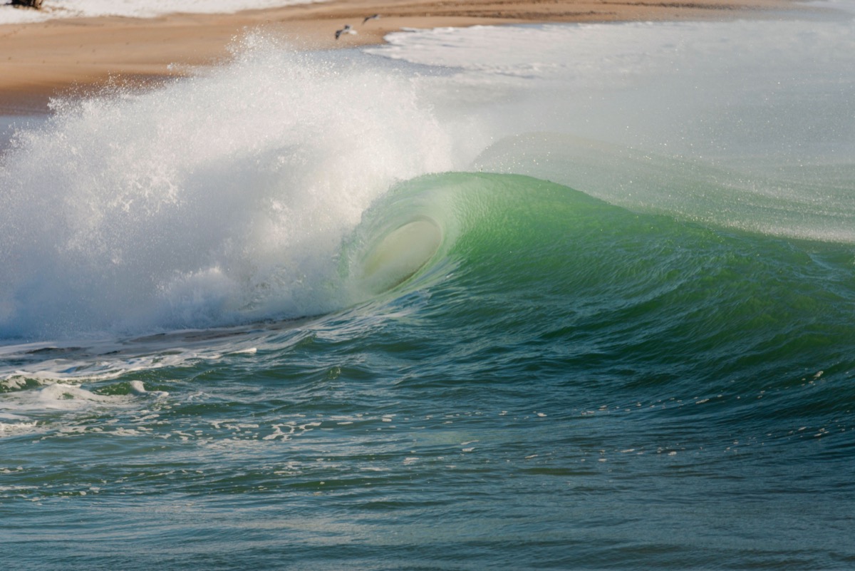 lean surf crashing on beach in Charlestown Rhode Island