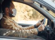 Man wearing a face mask while driving