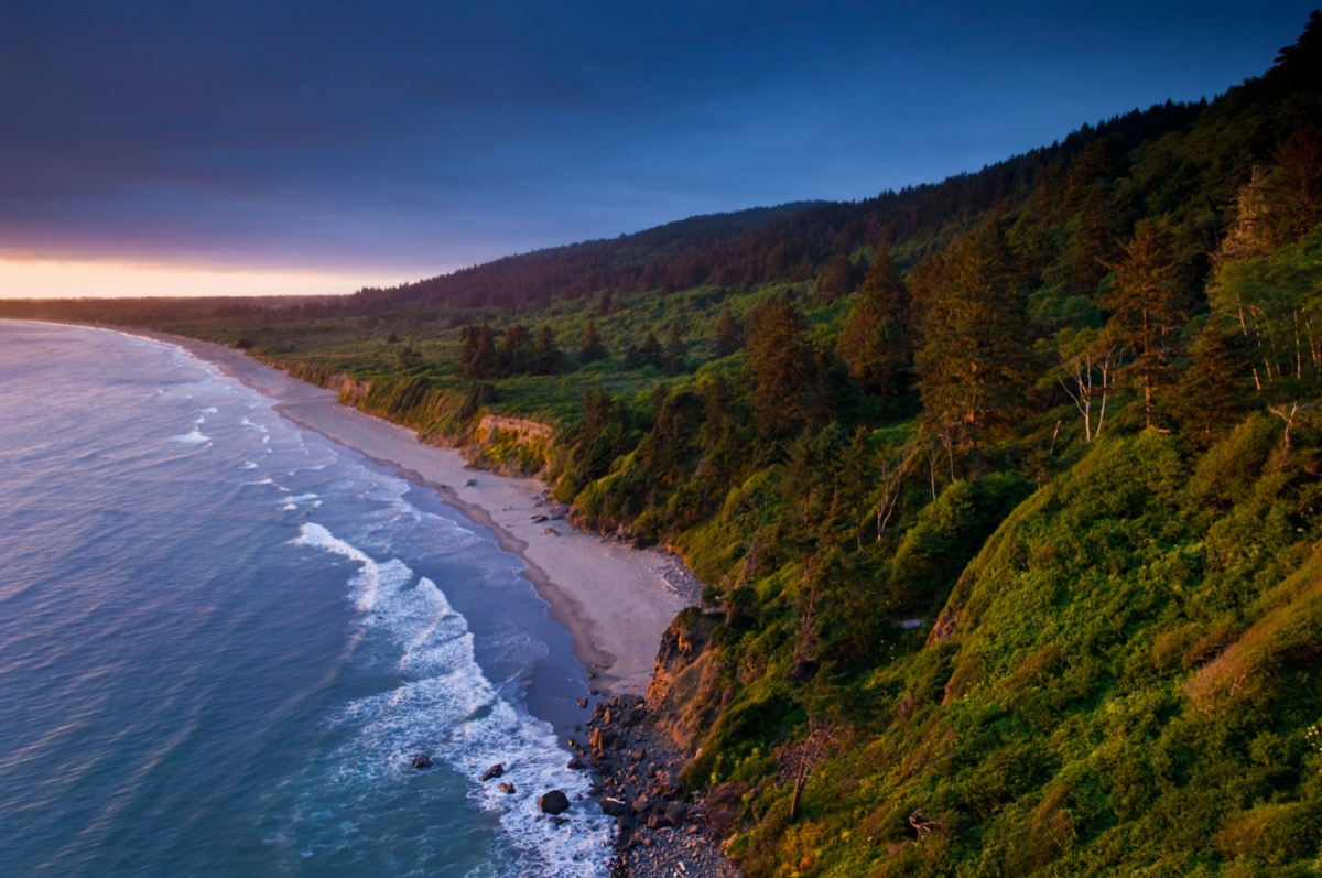 Sunset light and clouds over the hills above Enderts Beach, near Crescent City, Redwood National Park, California
