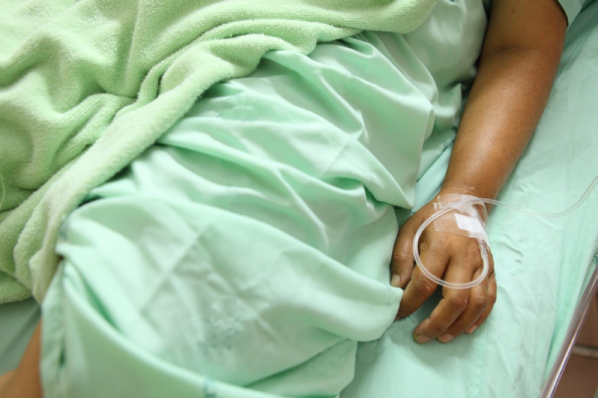 close up of woman's hand in hospital bed