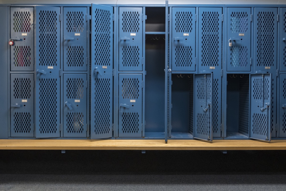 open and closed lockers in a school locker room
