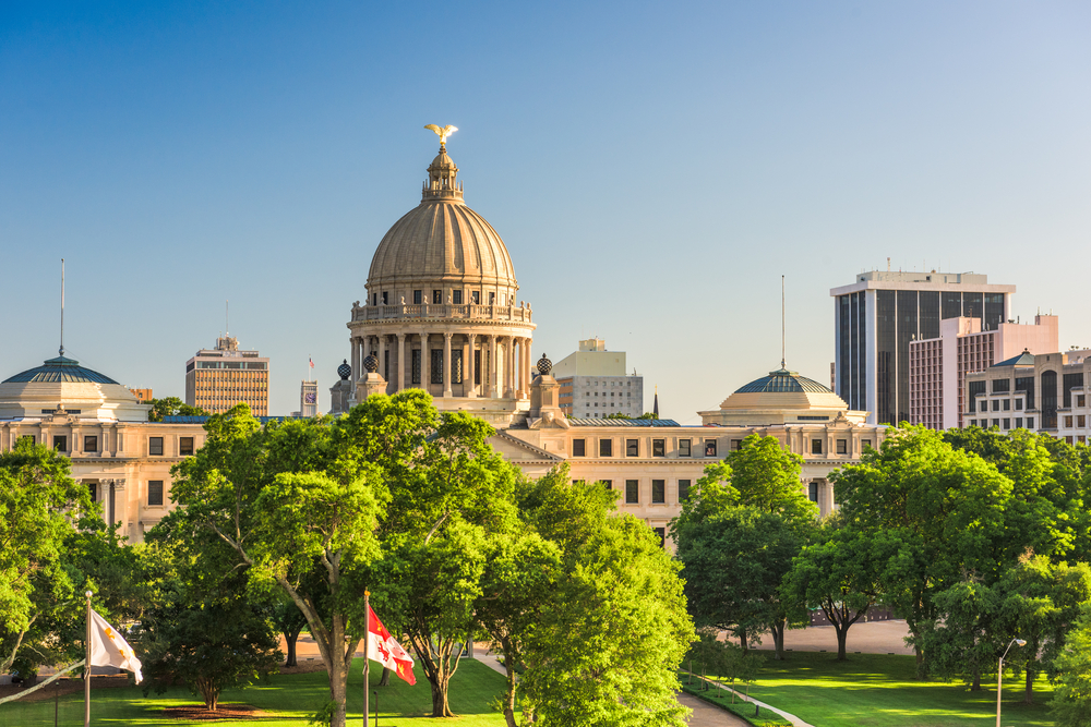 The downtown skyline of Jackson, Mississippi with the state house in the foreground
