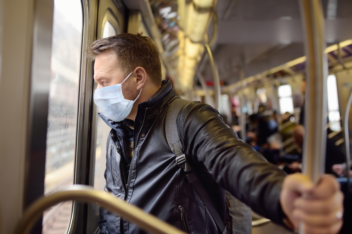 Man wearing a mask on the subway during the coronavirus pandemic 