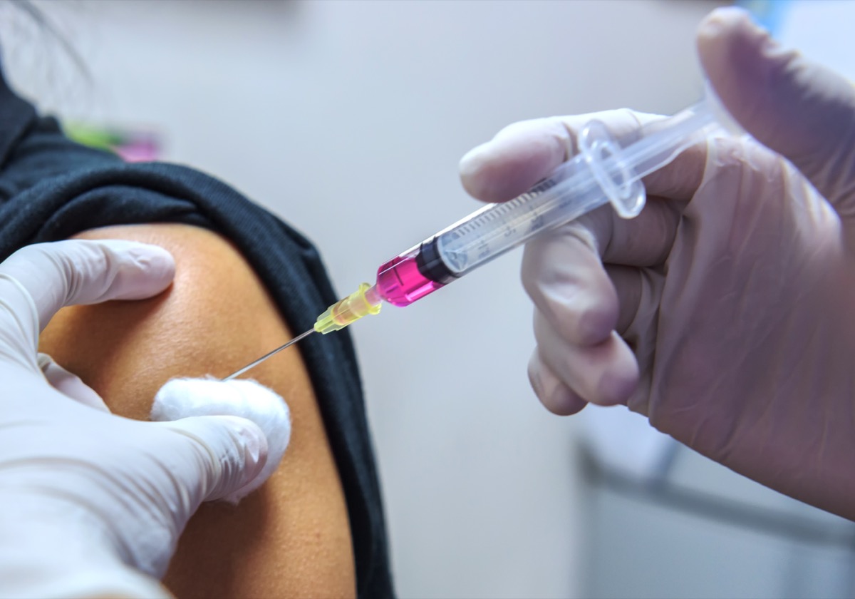Person getting coronavirus vaccine shot in arm