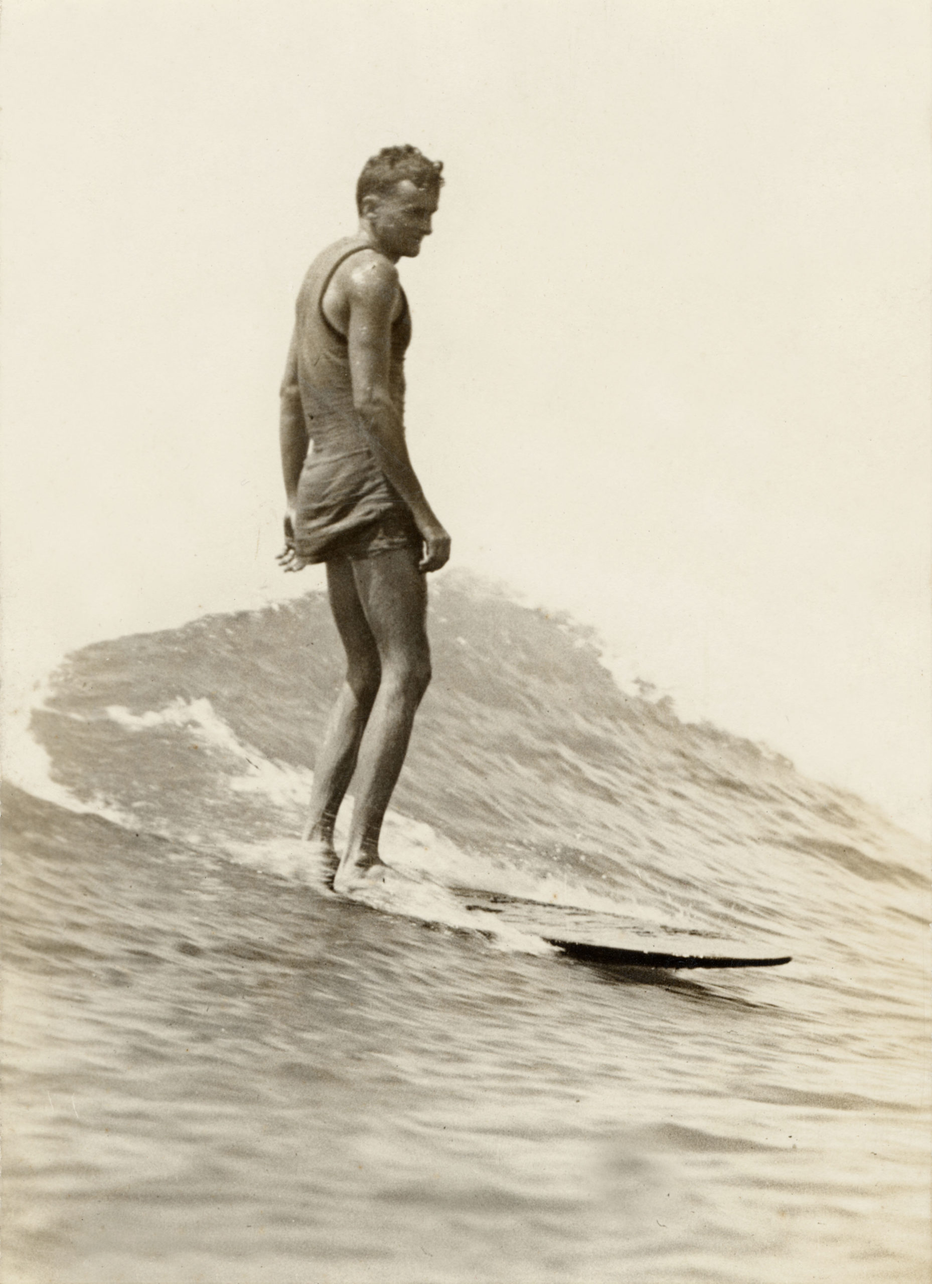 a man surfs in the 1920s