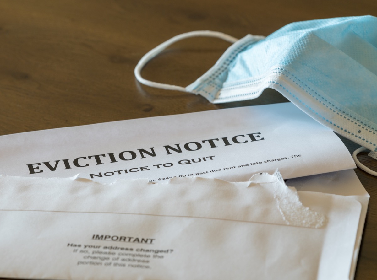 Eviction notice on table with mask