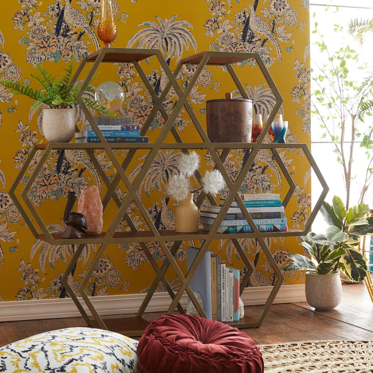 Drew Barrymore Collection hexagon bookshelf against wallpaper