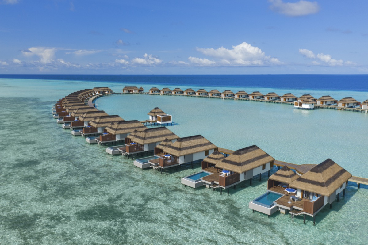 aerial view of the overwater bungalows at Pullman Maldives Maamutaa