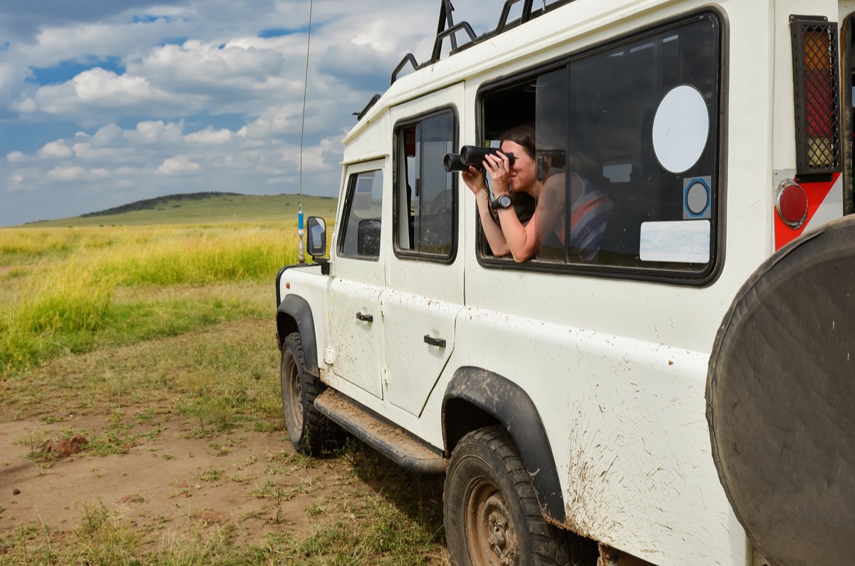 Woman on safari with binoculars