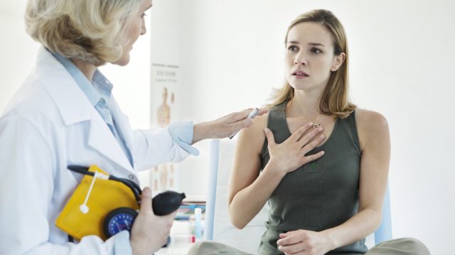 Woman at the doctor being treated for asthma