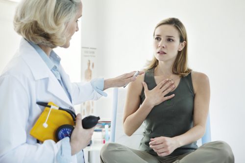 Woman at doctor being treated for asthma