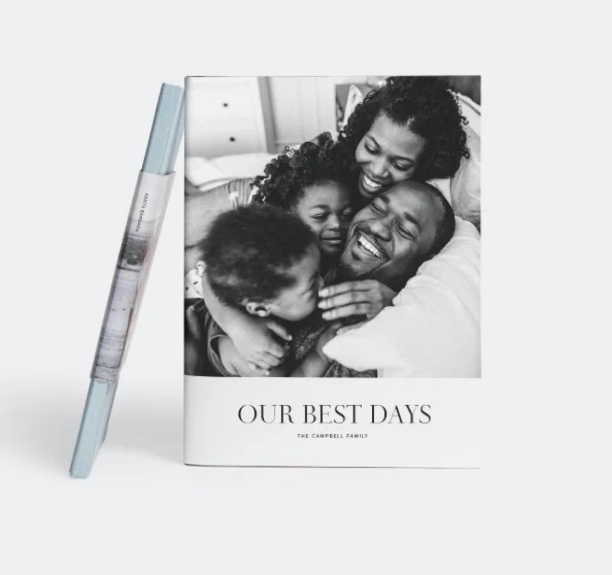 photo book with smiling black family in black and white photo on cover