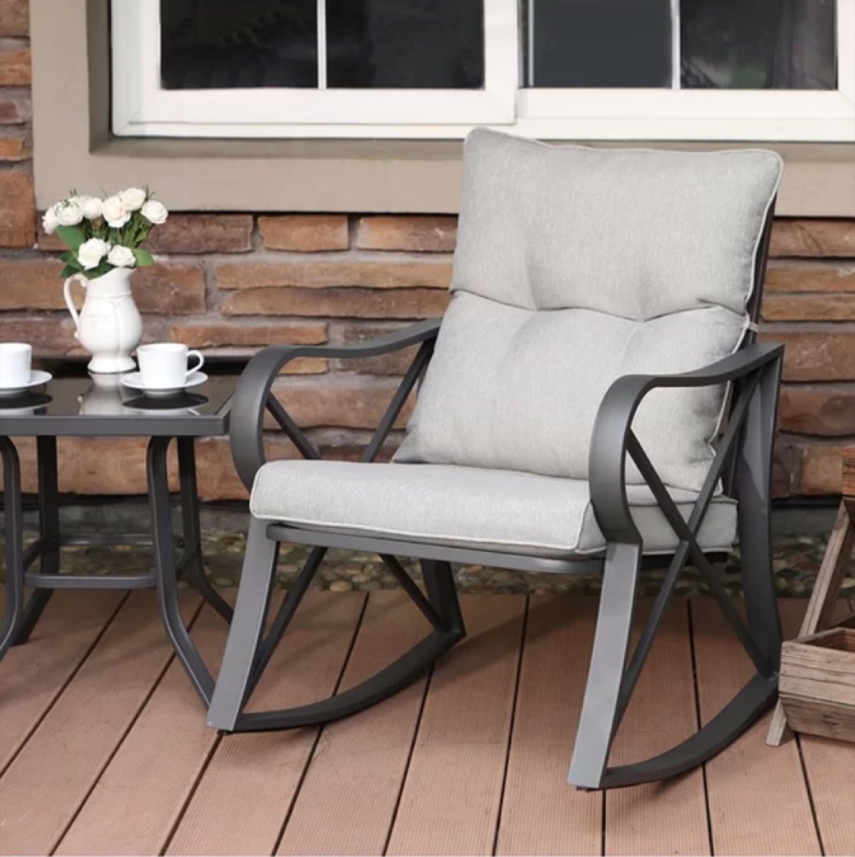 chair and table with metal legs on porch
