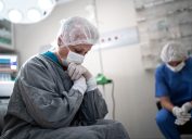 Worried healthcare coworkers at operating room in hospital