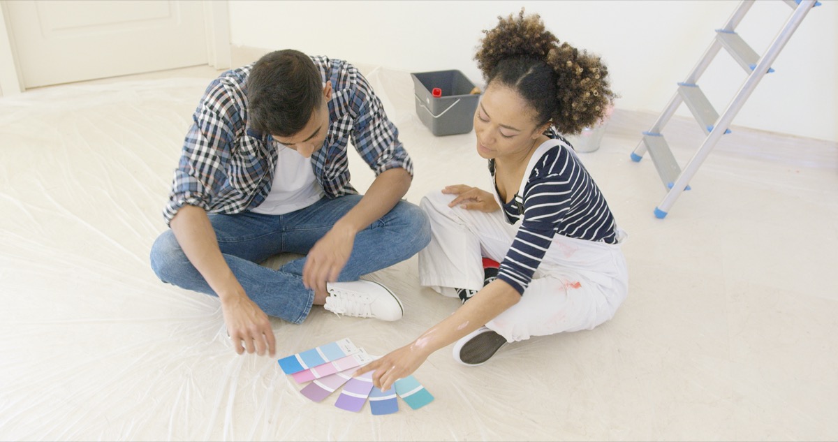 young couple looking at paint swatches