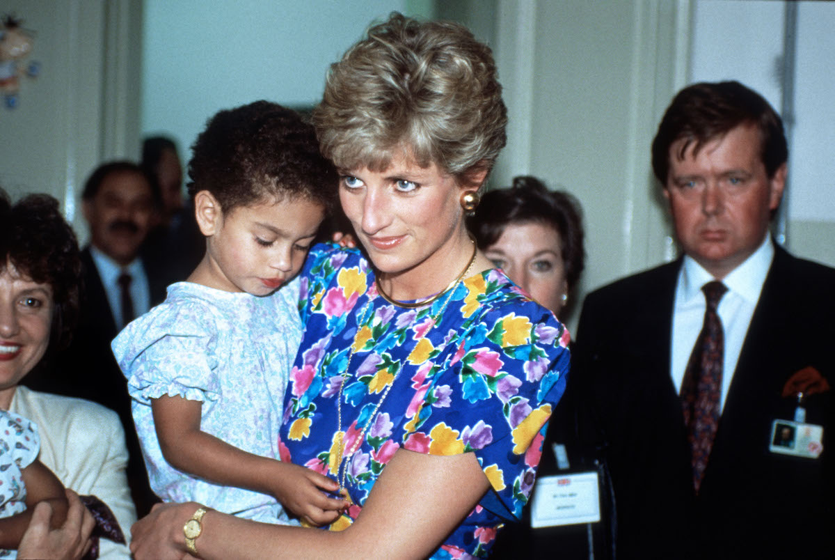 HRH Diana, Princess of Wales with a child affected with HIV AIDS during a visit to an orphanage, Sao Paulo, Brazil April 1991.