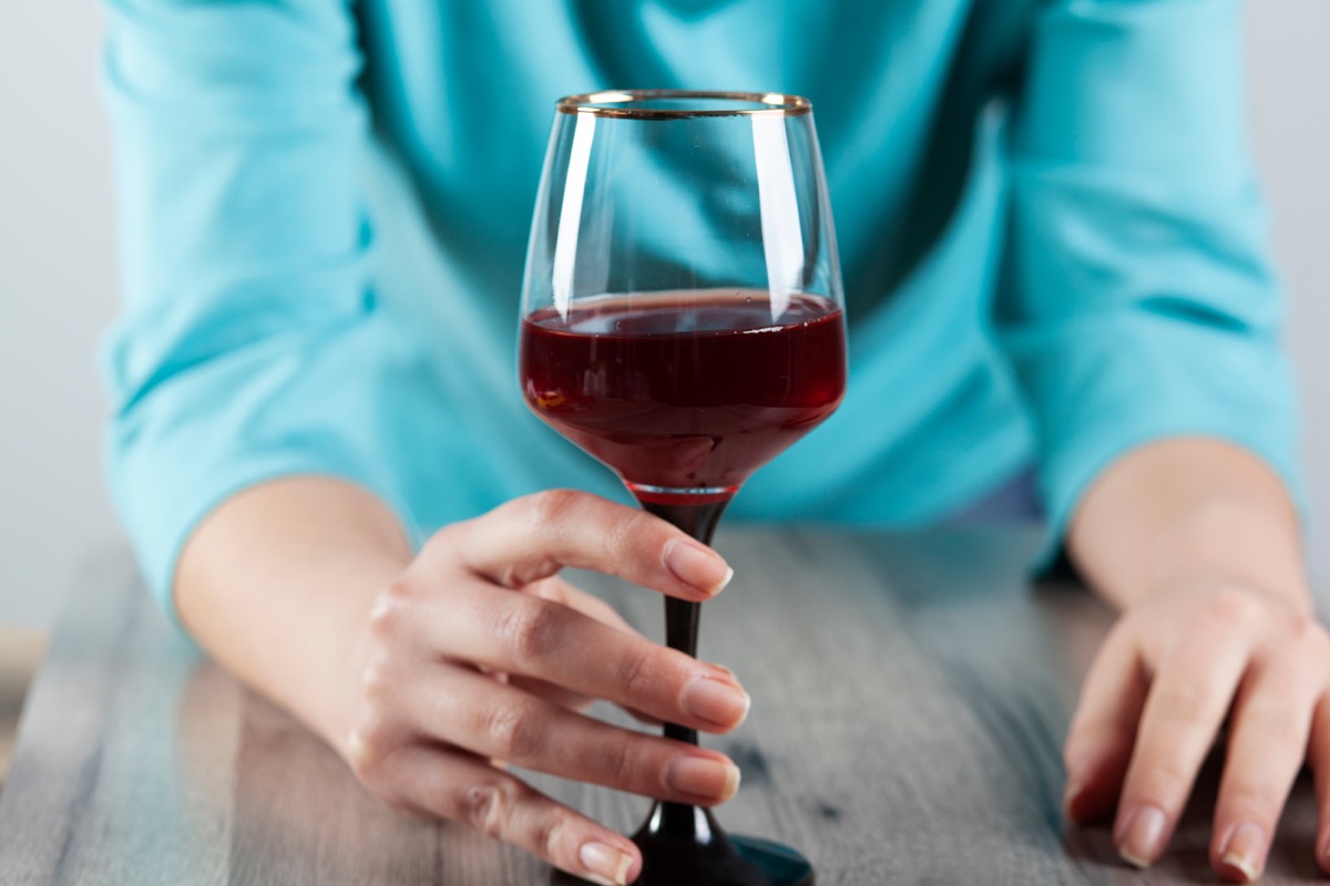 Woman with a glass of wine in her hand