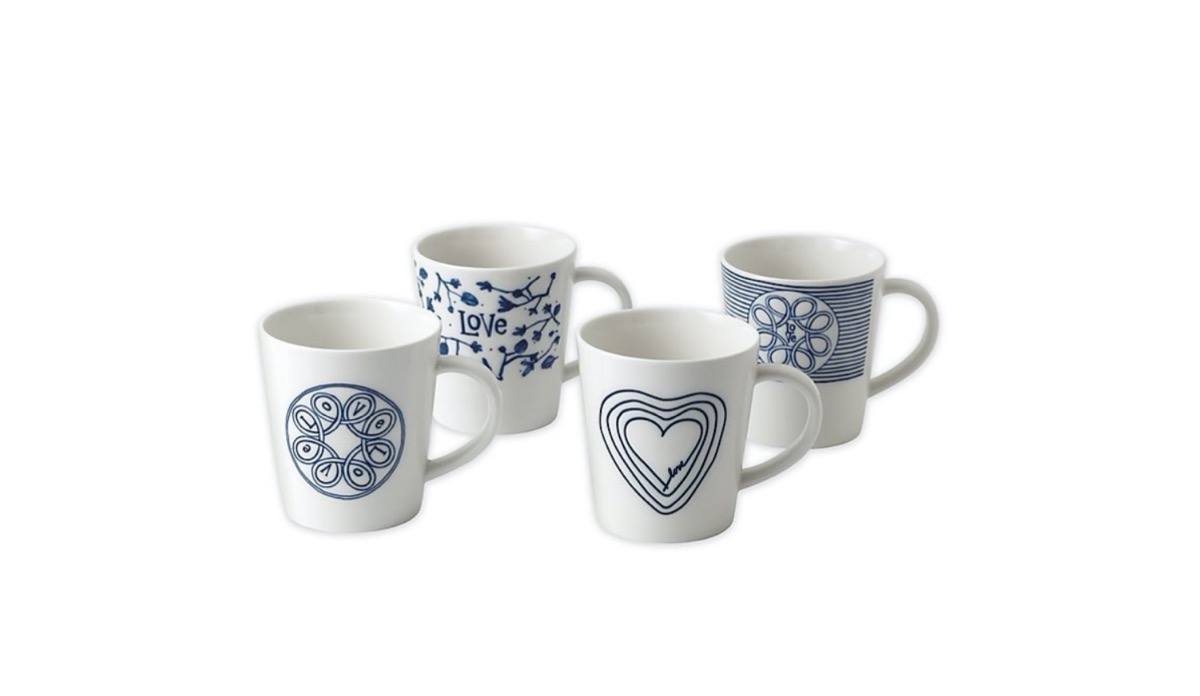 four white and blue ceramic mugs