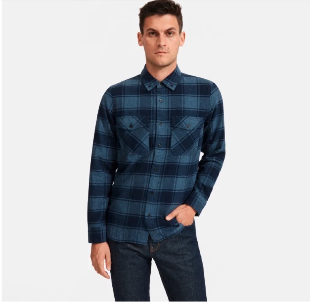young man in blue flannel plaid shirt