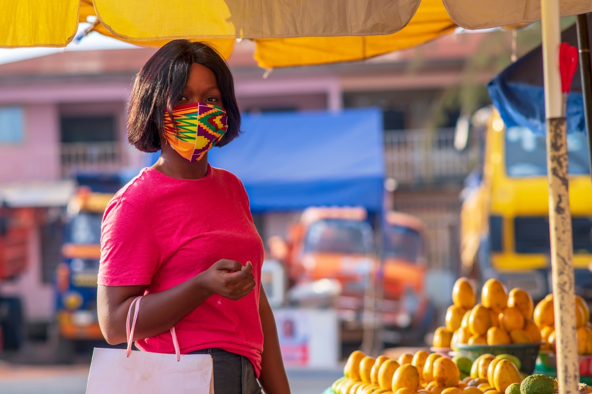 Woman wearing a mask while shopping outdoors