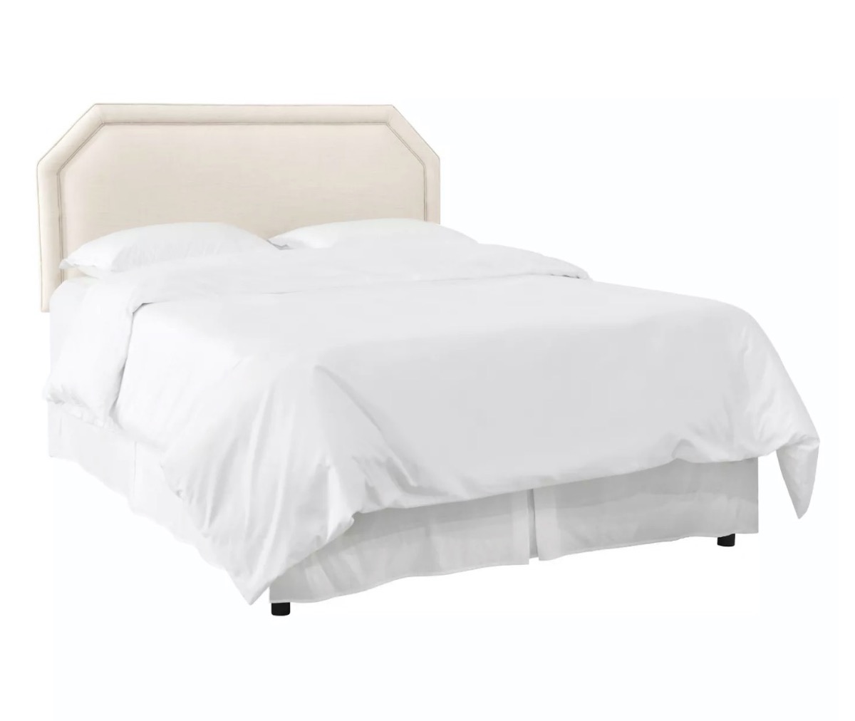 cream headboard with white bedding