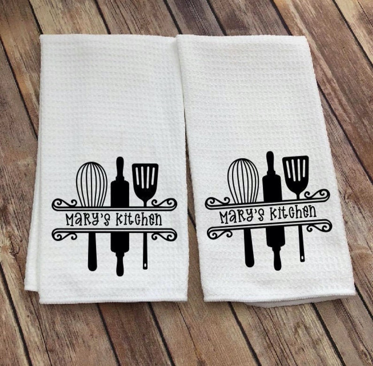 white personalized dish towels on wood background