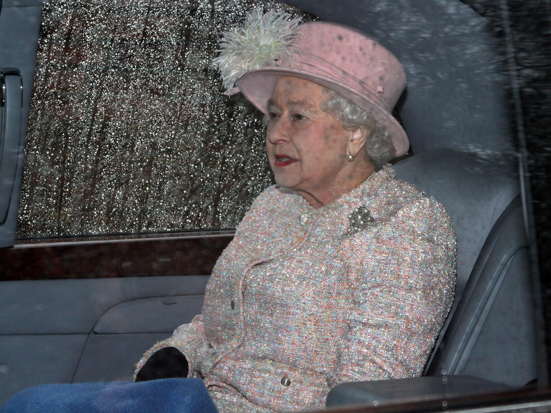 HM Queen Elizabeth II in a car with rain covered windows after attending St. Mary Magdalene Church for Sunday morning service in Sandringham in 2014
