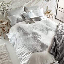 bedroom with white and gray comforter set with feather design