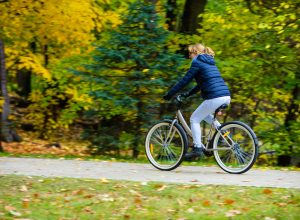 Woman riding a bike in the park