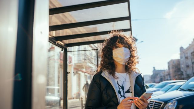 Woman wearing a mask outside