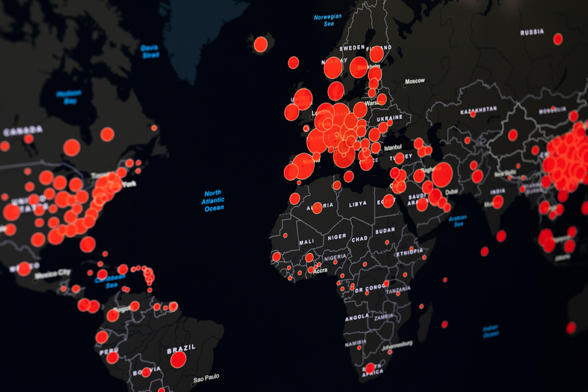 black map of world shows where COVID outbreaks are via red dots