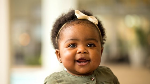 Black baby girl smiling