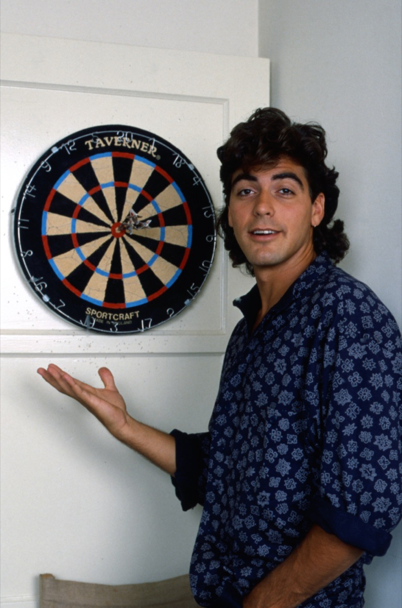 George Clooney with dart board