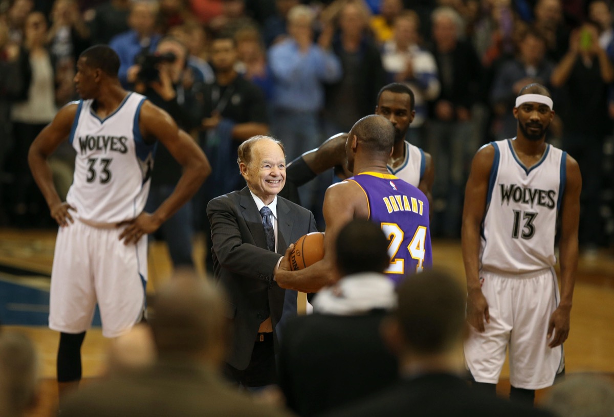 Minnesota Timberwolves owner Glen Taylor presents Kobe Bryant with the game ball after Bryant moved past Michael Jordan on the all-time scorers list on Sunday, Dec. 14, 2014, at the Target Center in Minneapolis.