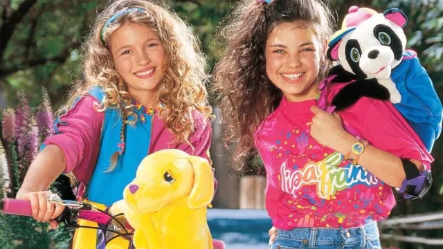 milas kunis and another young actor in a 1990s lisa frank ad