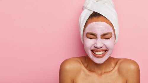Woman with skincare mask on