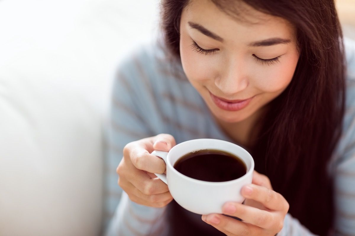 https://bestlifeonline.com/wp-content/uploads/sites/3/2020/09/Young-Asian-Woman-Drinking-Coffee.jpg?quality=82&strip=all