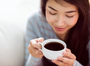Young Asian woman drinking